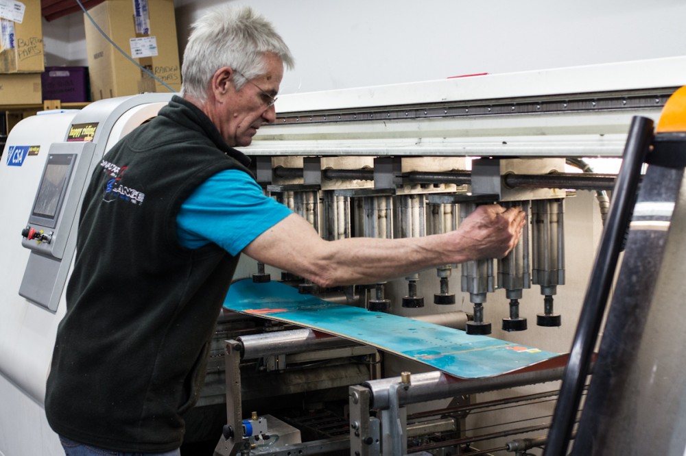 Martin adjusts the grinding machine.