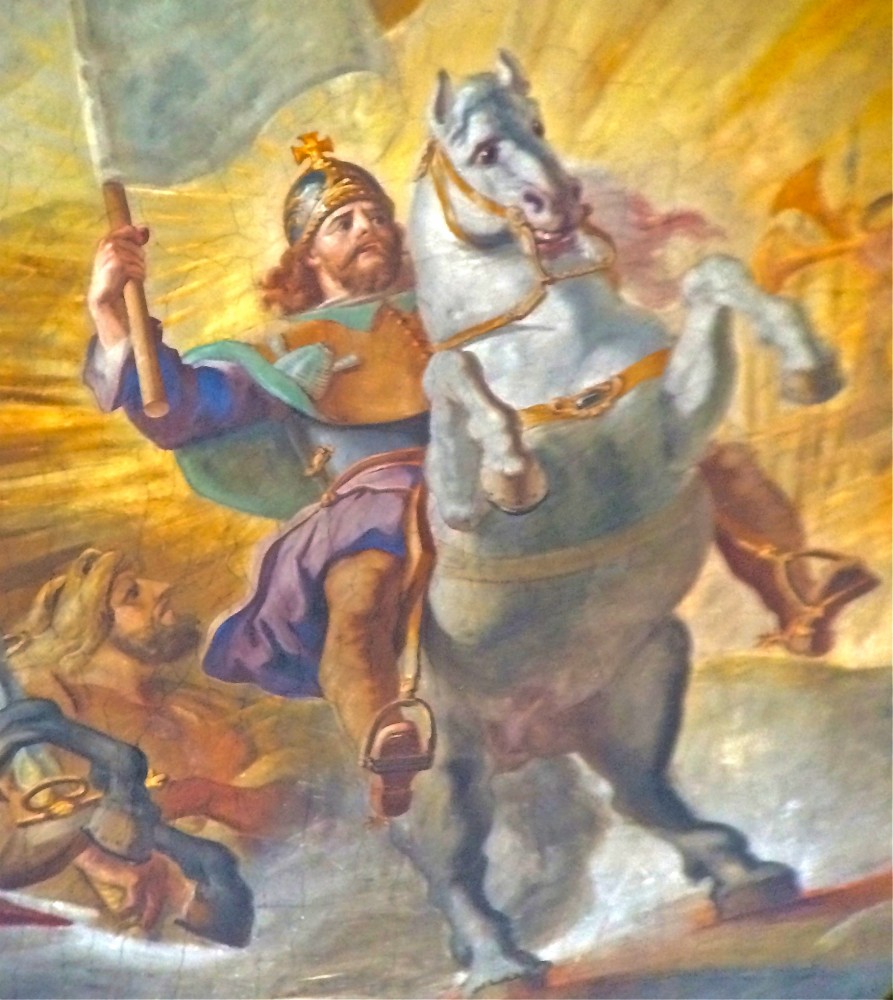 Der Heilige Jakob auf einem weißen Streitross. Man erkennt ihn übrigens auf allen Darstellungen, er trägt immer eine Muschel mit sich. 