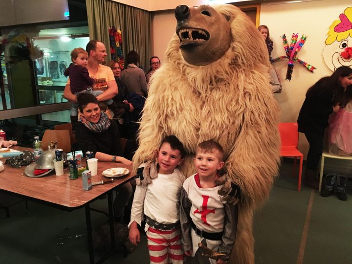 Children enjoying the bear's company. Fasching in Axams