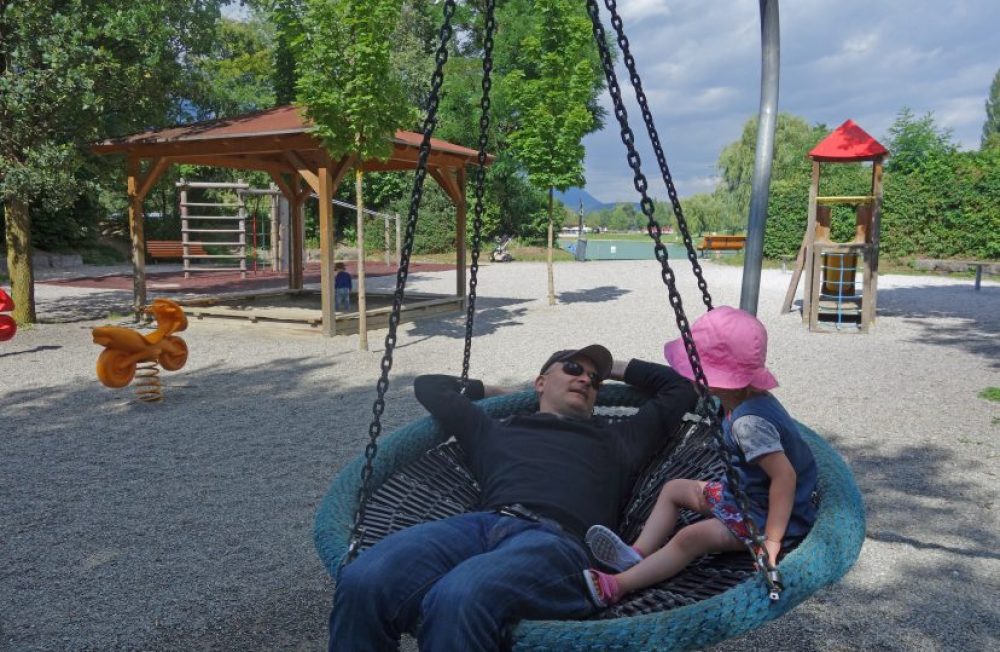 Family-friendly swimming lake with playground in Innsbruck