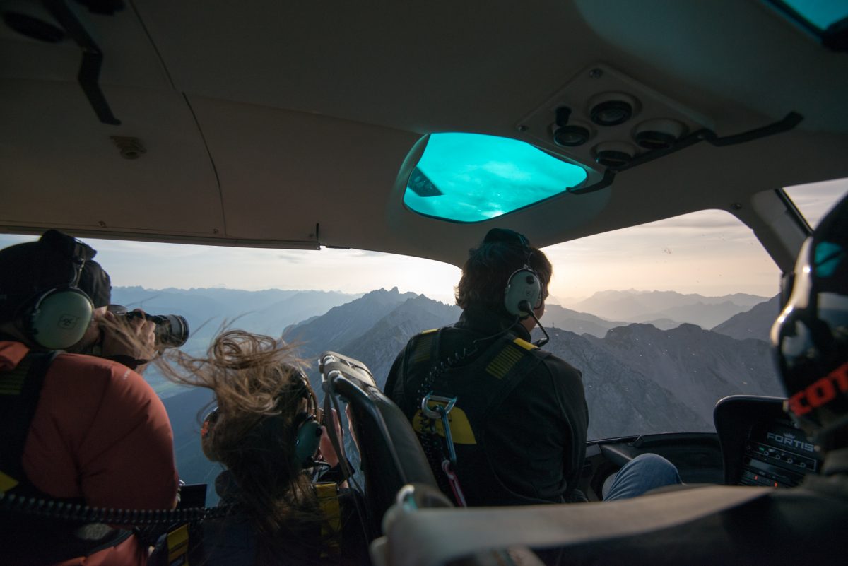 looking out helicopter cabin, Helicopter ride over Innsbruck with MySnapAir 