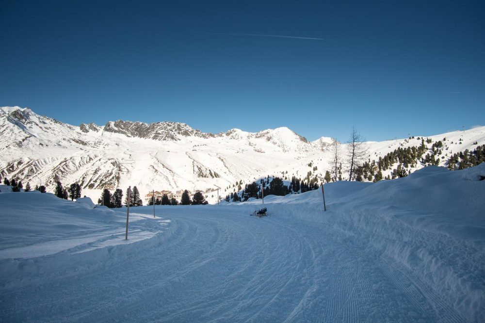 Tobogganing in snow covered Kühtai