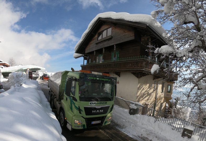 Dump trucks clearing snow